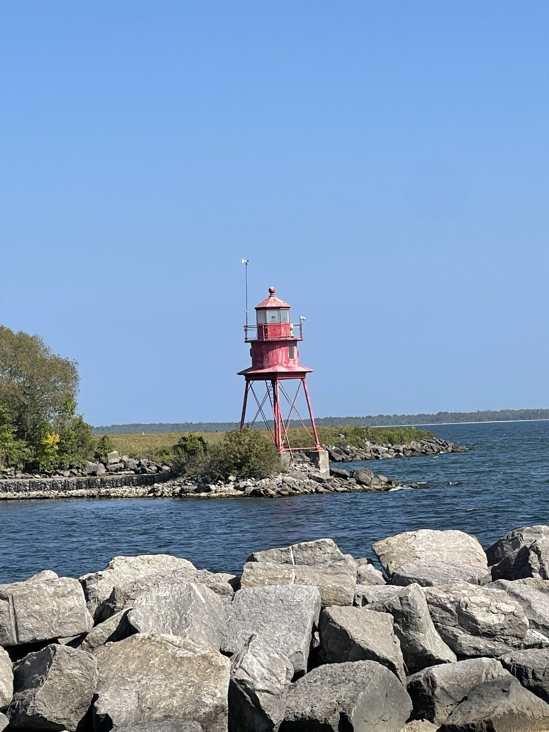 Picture of lighthouse and water with rocks